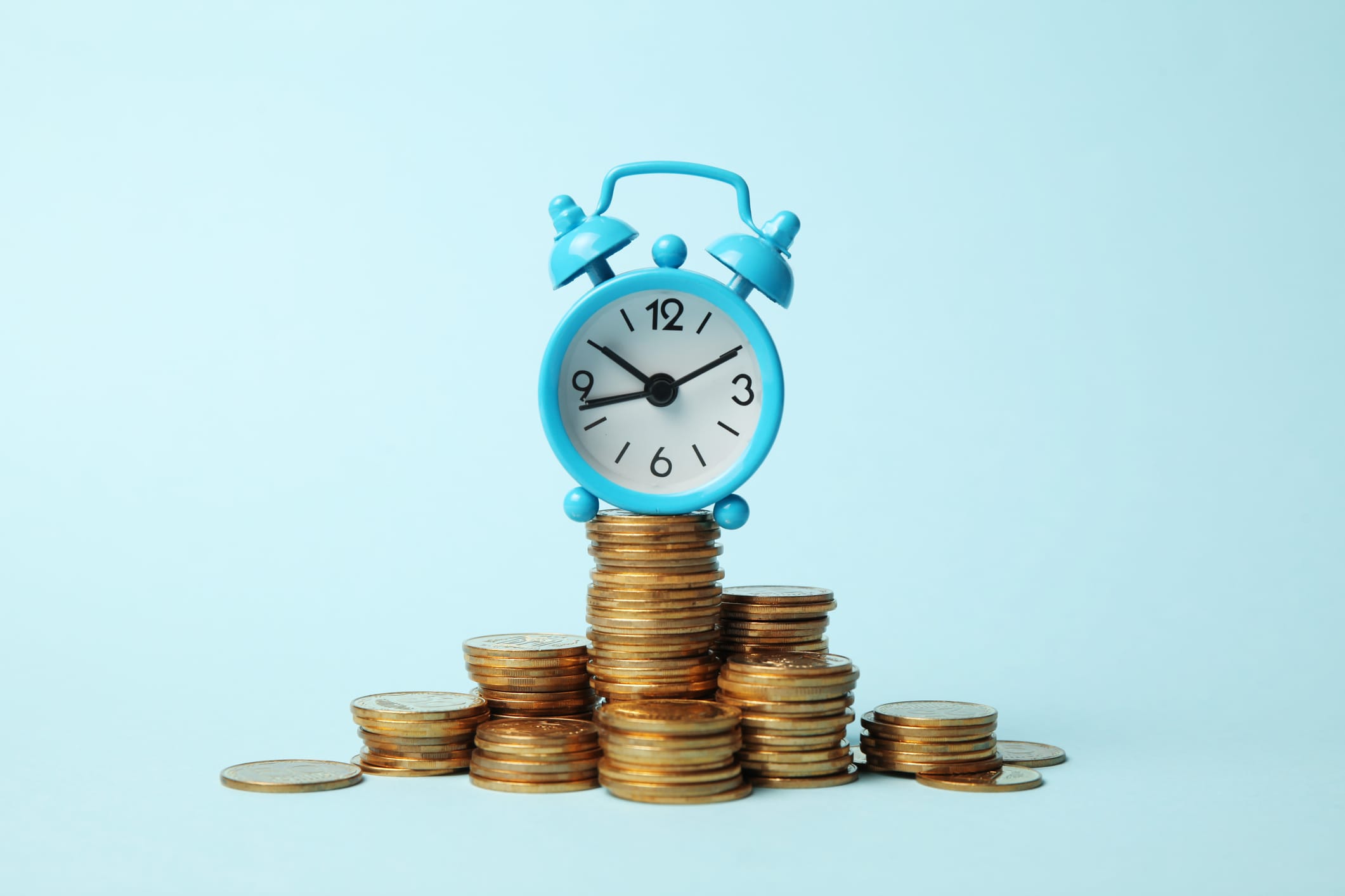 Finance investment, Time is money. Alarm clock and golden money coins, pension