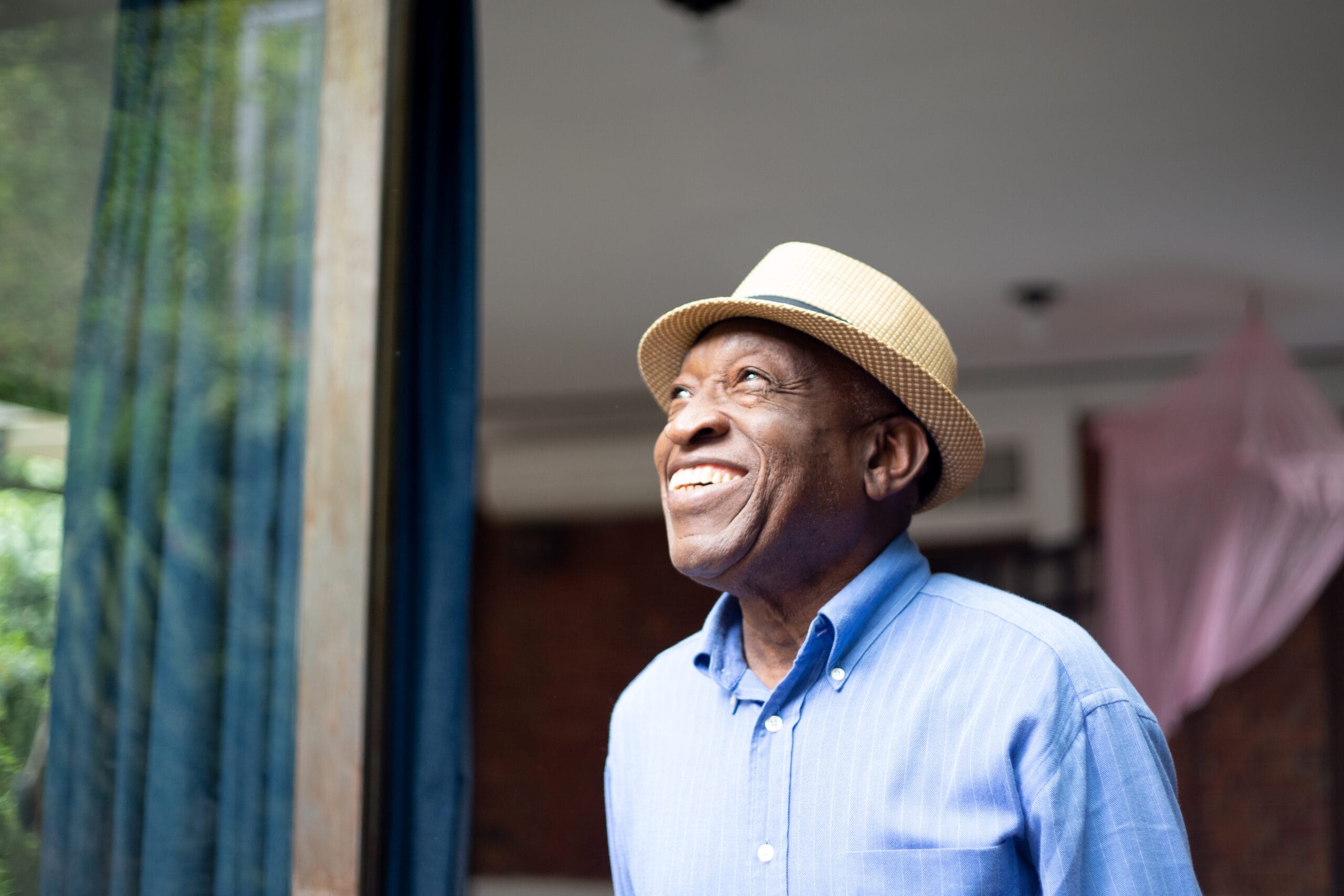 Afro Senior Looking Through The Window